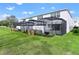 Modern townhouses with private screened patios and grassy yard at 17317 Hidden Forest Dr, Clermont, FL 34714