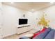 playroom featuring a large TV, comfy couch, and fun wall art at 17317 Hidden Forest Dr, Clermont, FL 34714