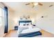 Spacious bedroom with king-size bed, nightstands, and ceiling fan at 17317 Hidden Forest Dr, Clermont, FL 34714