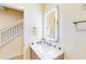 Clean bathroom with a lighted mirror and Mickey Mouse decor at 17317 Hidden Forest Dr, Clermont, FL 34714