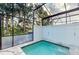 Enclosed private pool with patio furniture at 17317 Hidden Forest Dr, Clermont, FL 34714