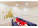 playroom with a couch and enchanting Disney castle wall art at 17317 Hidden Forest Dr, Clermont, FL 34714