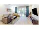 Spacious living room with comfortable seating and large TV at 17317 Hidden Forest Dr, Clermont, FL 34714