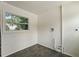 Bright laundry room with tile floor and window at 1689 Lakeshore Dr, Eustis, FL 32726
