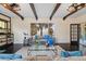 Bright living room with water views, hardwood floors, and a cozy seating area at 1689 Lakeshore Dr, Eustis, FL 32726