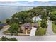 Stunning lakefront home with a large yard and a detached garage at 1689 Lakeshore Dr, Eustis, FL 32726