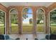 Sunroom with brick walls and expansive lake views at 1689 Lakeshore Dr, Eustis, FL 32726