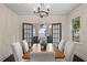 Dining room with lake views from French doors at 1689 Lakeshore Dr, Eustis, FL 32726