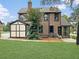 Brick home with a shed and patio area at 1689 Lakeshore Dr, Eustis, FL 32726