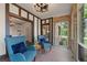 Sunroom features brick walls and views to other rooms at 1689 Lakeshore Dr, Eustis, FL 32726