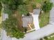 Aerial view of house, garage, and surrounding landscape at 1689 Lakeshore Dr, Eustis, FL 32726