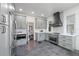 Renovated kitchen with stainless steel appliances and gray cabinetry at 1689 Lakeshore Dr, Eustis, FL 32726
