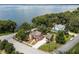 Lakefront home with a two-car garage and beautifully landscaped yard at 1689 Lakeshore Dr, Eustis, FL 32726