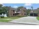 Renovated brick home with a large driveway at 1689 Lakeshore Dr, Eustis, FL 32726