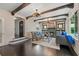 Spacious living room with fireplace, exposed beams, and large windows at 1689 Lakeshore Dr, Eustis, FL 32726