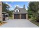 Two-car garage with dark brown doors and concrete driveway at 1689 Lakeshore Dr, Eustis, FL 32726