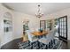 Elegant dining room with built-in shelving and access to other rooms at 1689 Lakeshore Dr, Eustis, FL 32726