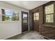 Convenient laundry room with exterior access and dark brown doors at 1689 Lakeshore Dr, Eustis, FL 32726