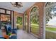 Sunroom offers relaxing seating and picturesque lake views at 1689 Lakeshore Dr, Eustis, FL 32726