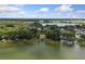 Lakeside community with houses and lush green spaces at 1689 Lakeshore Dr, Eustis, FL 32726