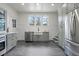 Updated kitchen with farmhouse sink, stainless steel appliances, and gray cabinets at 1689 Lakeshore Dr, Eustis, FL 32726