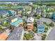 Aerial view of a waterfront community of colorful homes at 8016 Flip Flop Way, Kissimmee, FL 34747
