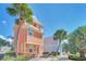 Two-story house with a patio, palm trees, and a bright exterior at 8016 Flip Flop Way, Kissimmee, FL 34747
