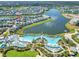 Aerial view showing home location near resort-style pool and lake at 8016 Flip Flop Way, Kissimmee, FL 34747