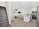 Open living room and kitchen with hardwood floors and modern appliances at 8016 Flip Flop Way, Kissimmee, FL 34747