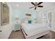 Main bedroom with a king-size bed and private access to balcony at 8016 Flip Flop Way, Kissimmee, FL 34747