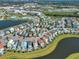 Aerial view of community with lake and pools at 8016 Flip Flop Way, Kissimmee, FL 34747