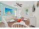 Living room features a sofa, dining area, and a view to the outdoors at 8016 Flip Flop Way, Kissimmee, FL 34747