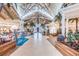 Spacious resort lobby with high ceilings and tropical plants at 8016 Flip Flop Way, Kissimmee, FL 34747