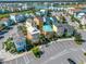 Bird's-eye view of a vibrant community with colorful houses at 8016 Flip Flop Way, Kissimmee, FL 34747