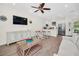 Open concept living area with kitchen, dining, and living room at 8016 Flip Flop Way, Kissimmee, FL 34747