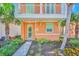 Front entrance of two-story house with landscaping and walkway at 8016 Flip Flop Way, Kissimmee, FL 34747