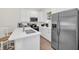Modern kitchen with stainless steel appliances and white cabinetry at 8016 Flip Flop Way, Kissimmee, FL 34747