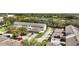 Aerial view showcasing townhouses near a tranquil lake at 6364 Lake Smith Cir, Windermere, FL 34786