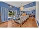 Elegant dining room with hardwood floors, a large table, and ample seating at 9 Stone Gate N, Longwood, FL 32779