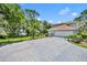 Spacious driveway with pavers, offering ample parking and lake views at 9 Stone Gate N, Longwood, FL 32779