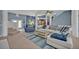 Open floor plan living room with comfortable seating and a view of the dining area at 9 Stone Gate N, Longwood, FL 32779