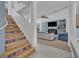 Elegant staircase with patterned risers leading to the upper level at 9 Stone Gate N, Longwood, FL 32779