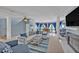 Spacious living area with a cozy seating arrangement, fireplace and large windows at 9 Stone Gate N, Longwood, FL 32779