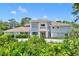 Two-story house with a circular driveway and lush landscaping at 9 Stone Gate N, Longwood, FL 32779
