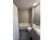Bathroom with a bathtub, granite vanity and tiled walls at 39 Fisher Lane Trak, Ocklawaha, FL 32179