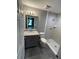 Bathroom with shower, toilet, vanity, and granite countertop at 39 Fisher Lane Trak, Ocklawaha, FL 32179