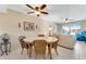 Bright dining area with a round table and wicker chairs at 3801 S Atlantic Ave # 321, New Smyrna Beach, FL 32169