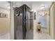 Black refrigerator and white appliances in kitchen at 3801 S Atlantic Ave # 321, New Smyrna Beach, FL 32169