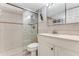 Bathroom with tiled shower and double vanity at 3801 S Atlantic Ave # 321, New Smyrna Beach, FL 32169