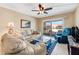 Living room with beige sofa and glass coffee table at 3801 S Atlantic Ave # 321, New Smyrna Beach, FL 32169